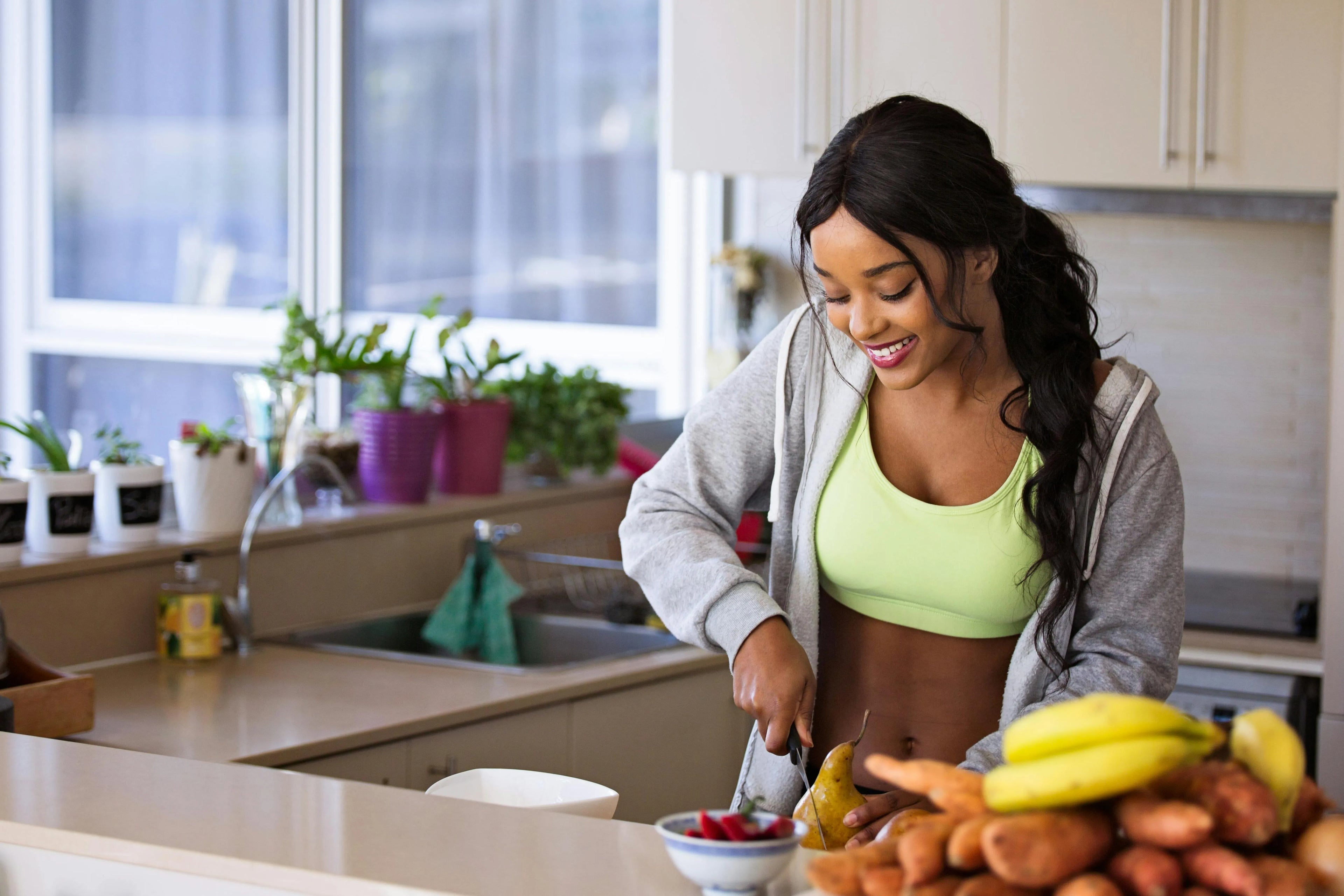 The girls are making healthy food in the kitchen