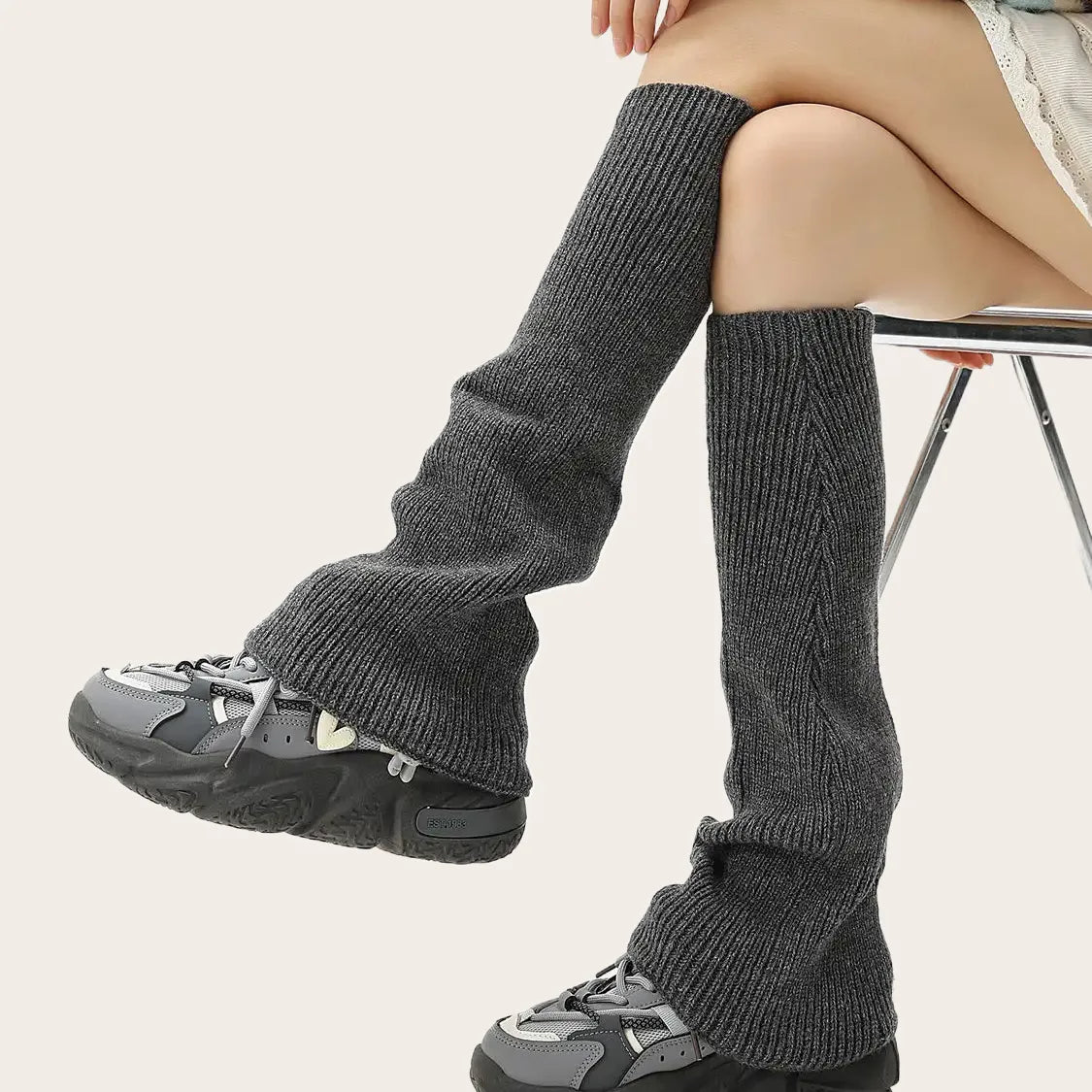 Charcoal grey over-the-knee knit leg warmers paired with cozy fall fashion.