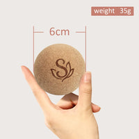 Close-up of a 6cm cork massage ball weighing 35g, showing its lightweight and portable design. Great for travel-friendly fitness routines and post-workout muscle care.
