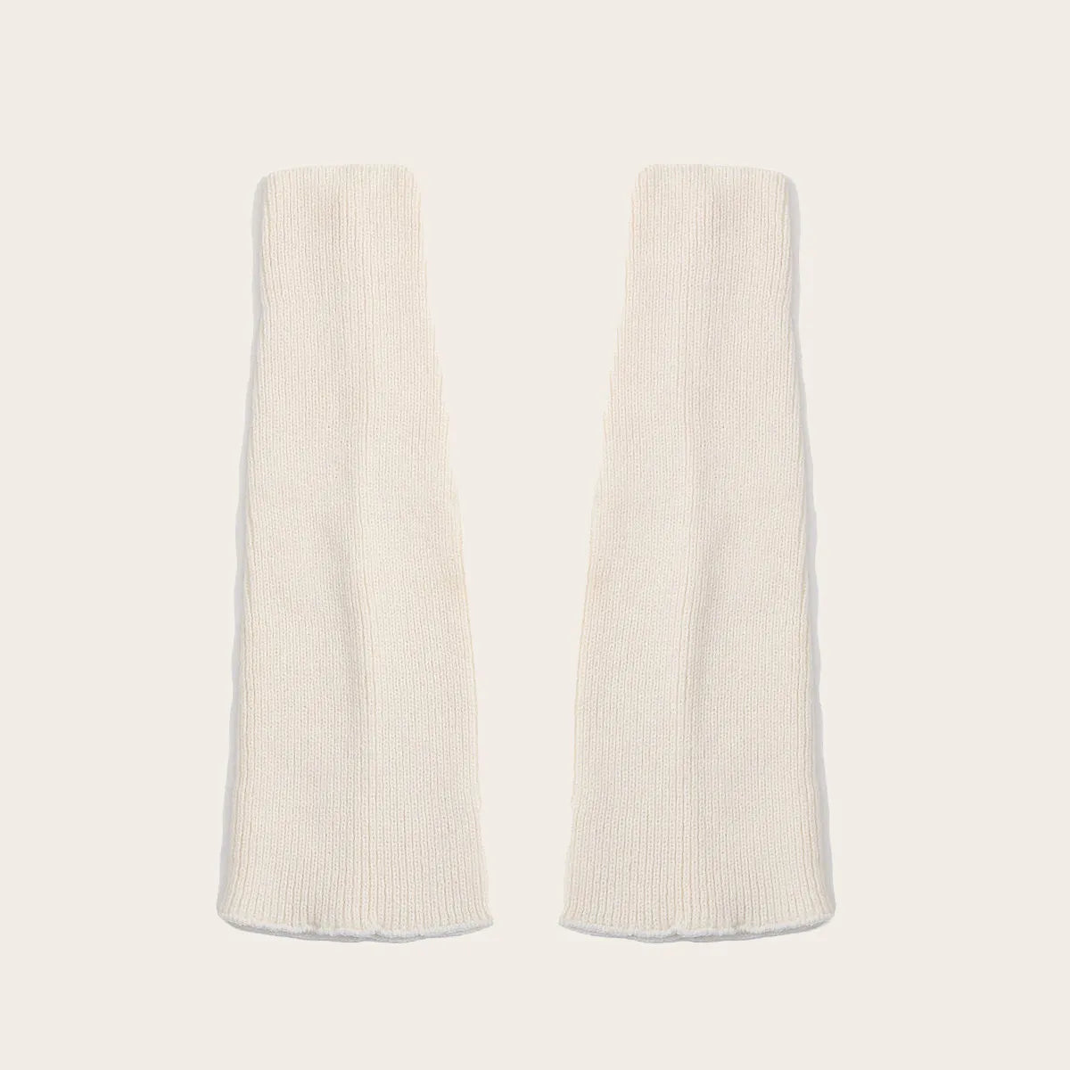Cream white knit leg warmers for women – cozy color option for fall and winter outfits.