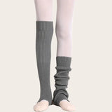 Light grey ribbed knit stirrup leg warmers by Sportive Lives for ballet, yoga, and pilates.