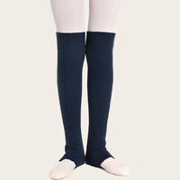 Navy blue ribbed leg warmers with open heel stirrup for flexible foot movement in dance and fitness.