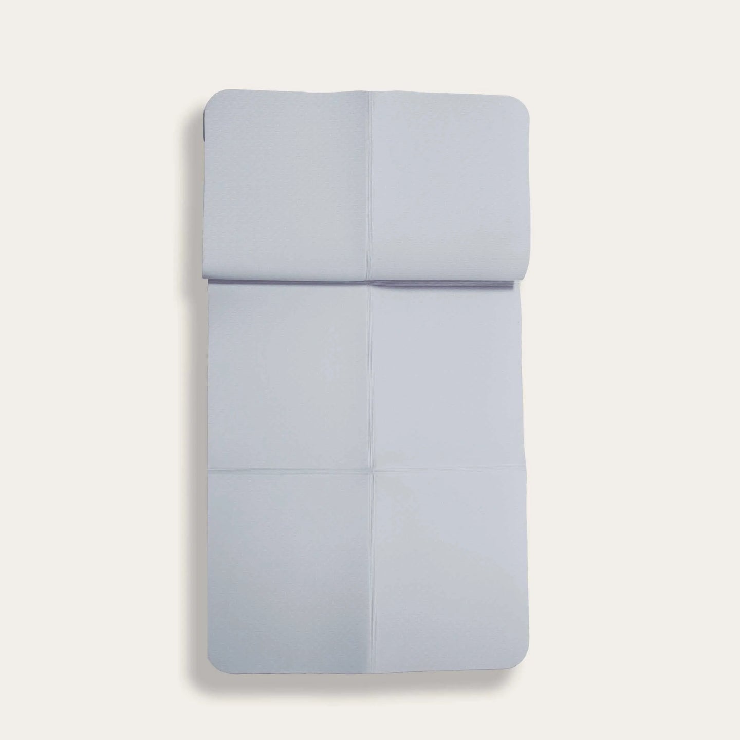 Light grey foldable TPE yoga mat from Sportive Lives, perfect for portable and eco-friendly yoga practice in Canada. Foldable design for easy storage and travel.