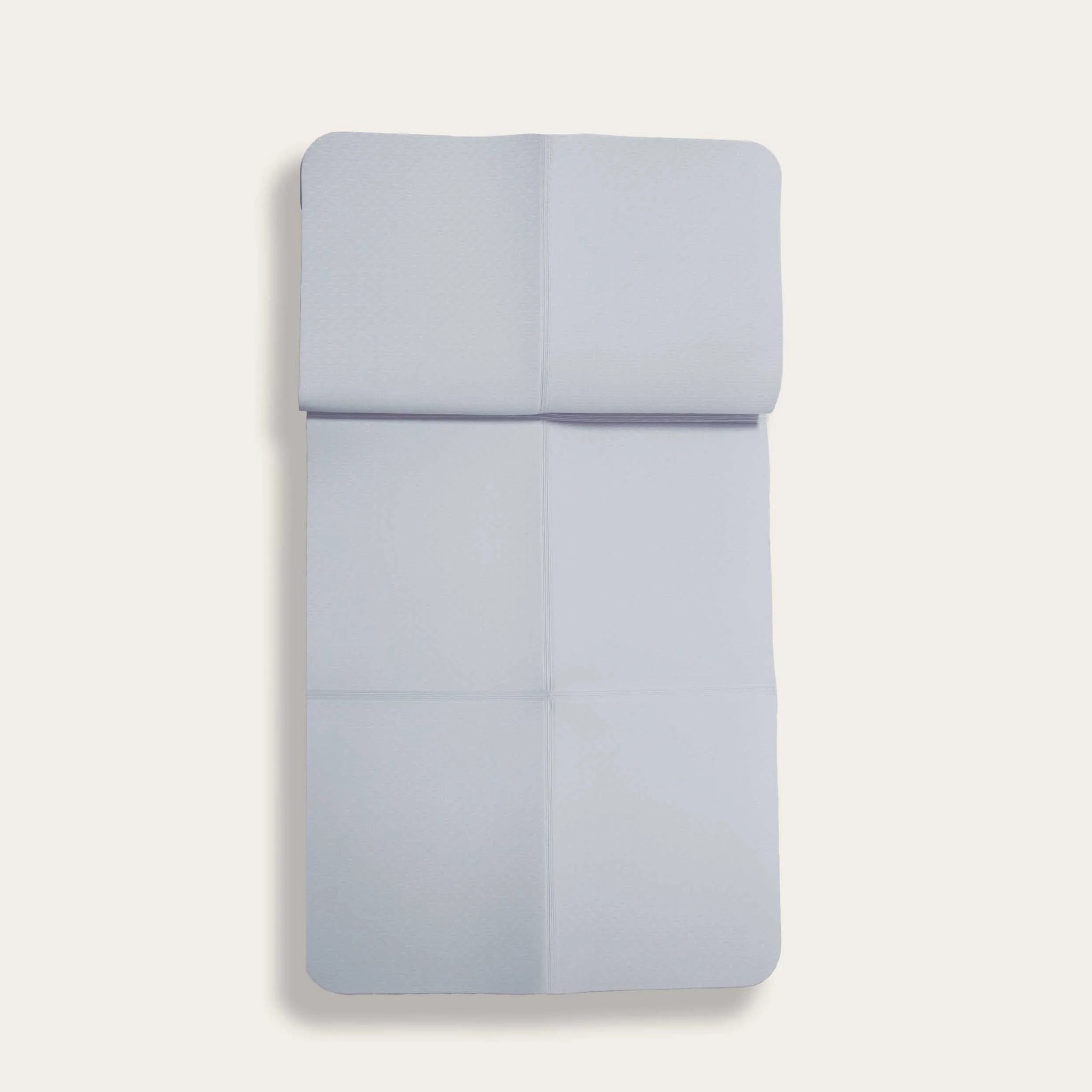 Light grey foldable TPE yoga mat from Sportive Lives, perfect for portable and eco-friendly yoga practice in Canada. Foldable design for easy storage and travel.