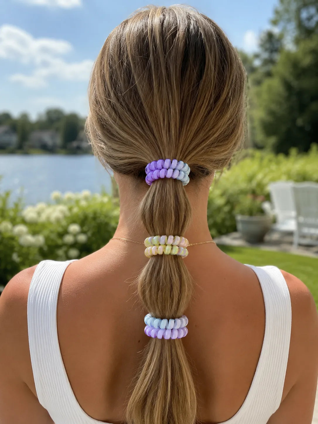 Pastel Jelly Spiral Hair Ties styled along a low ponytail in purple, rainbow and blue colour combinations.