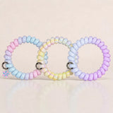 Set of 3 Jelly Spiral Hair Ties in pastel purple, blue and multicolour designs with a glossy coil finish.