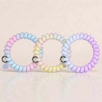 Set of 3 Jelly Spiral Hair Ties in pastel purple, blue and multicolour designs with a glossy coil finish.