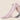 Woman wearing pink over-the-knee compression socks, showcasing slim fit and ergonomic foot support design