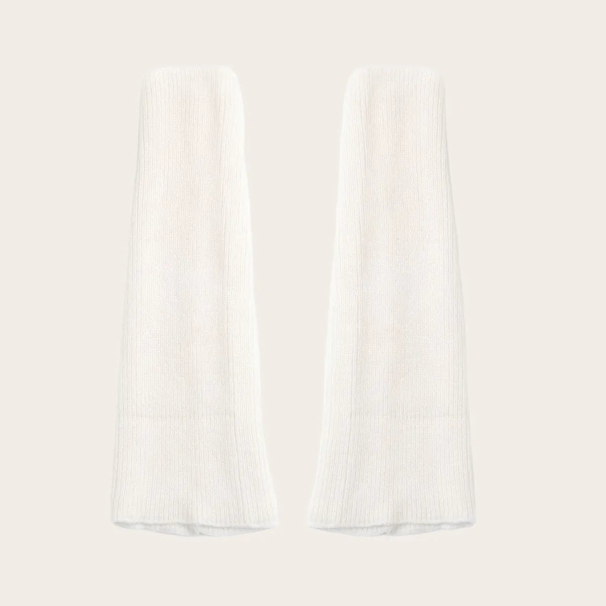 Pure white ribbed knit leg warmers – fresh and soft color choice for winter layering.