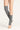 Close-up of grey SLIM Leg Warmer by Sportive Lives, showing ribbed knit texture and over-the-knee stretch fit. Designed for dancers and yoga practitioners in Canada who need comfort, flexibility, and warmth during warm-up or daily wear.