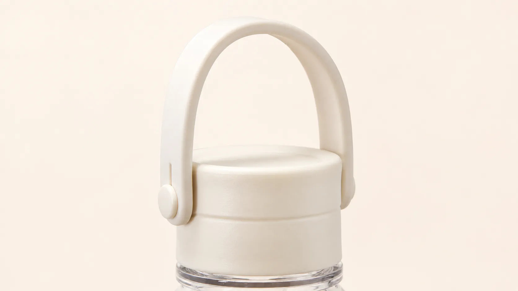 Close-up of the warm white SPL Stainless Steel Straw Bottle carry handle lid with a soft matte finish
