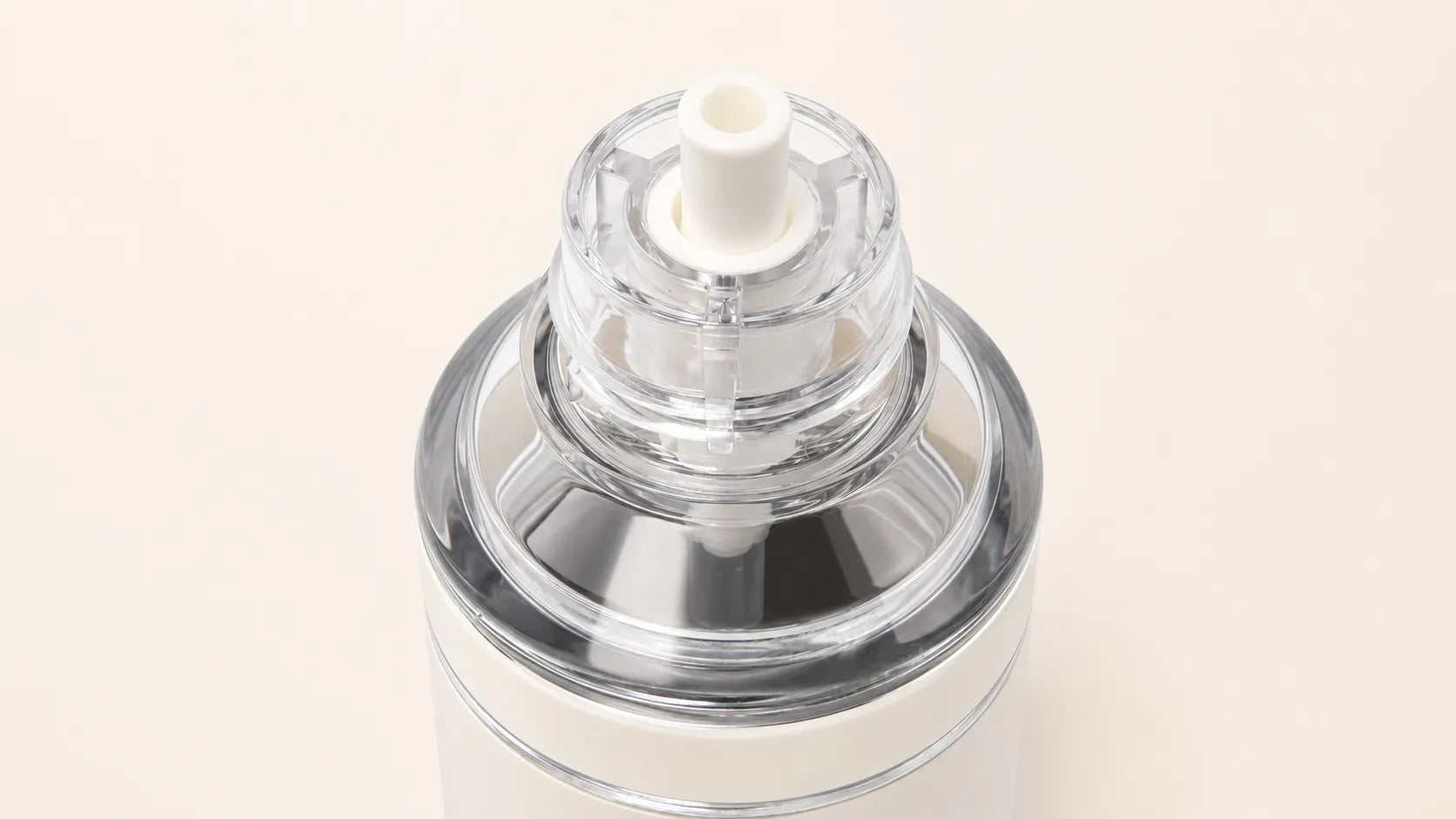 Top-down close-up of the SPL Stainless Steel Straw Bottle clear straw lid and drinking spout