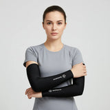 Woman in gray tee wearing black arm sleeves; cooling, stretchy UV sleeves ideal for running, cycling and everyday training.