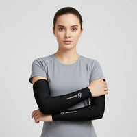 Woman in gray tee wearing black arm sleeves; cooling, stretchy UV sleeves ideal for running, cycling and everyday training.