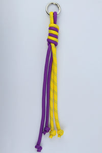 Sportive Lives braided rope bag charm keychain in Purple & Yellow, Heart Clip—bright paracord-style bag charm for fanny packs, backpacks and keys, Canada.