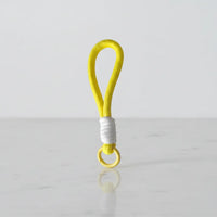 Lemon yellow braided rope charm with white wrap—cup handle loop & keychain, Canada.