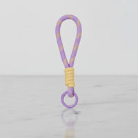 Lilac rope charm with butter wrap and ring—clip-on handle/keychain by Sportive Lives, Canada.