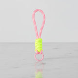 Pastel pink patterned rope with neon-yellow wrap, pink ring—bright clip-on cup handle and bag charm; lightweight braided rope, Sportive Lives Canada.