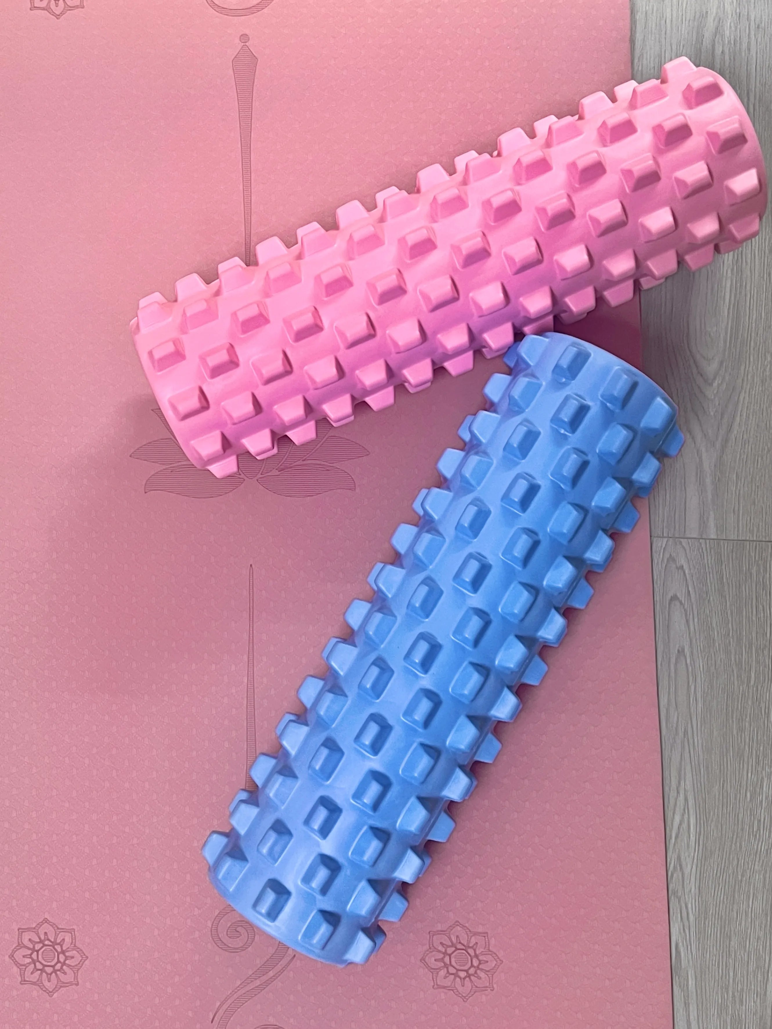 Sportive Lives pink and ice blue EVA Massage Roller PRO on yoga mat, ideal for muscle recovery and deep tissue massage in Canada.