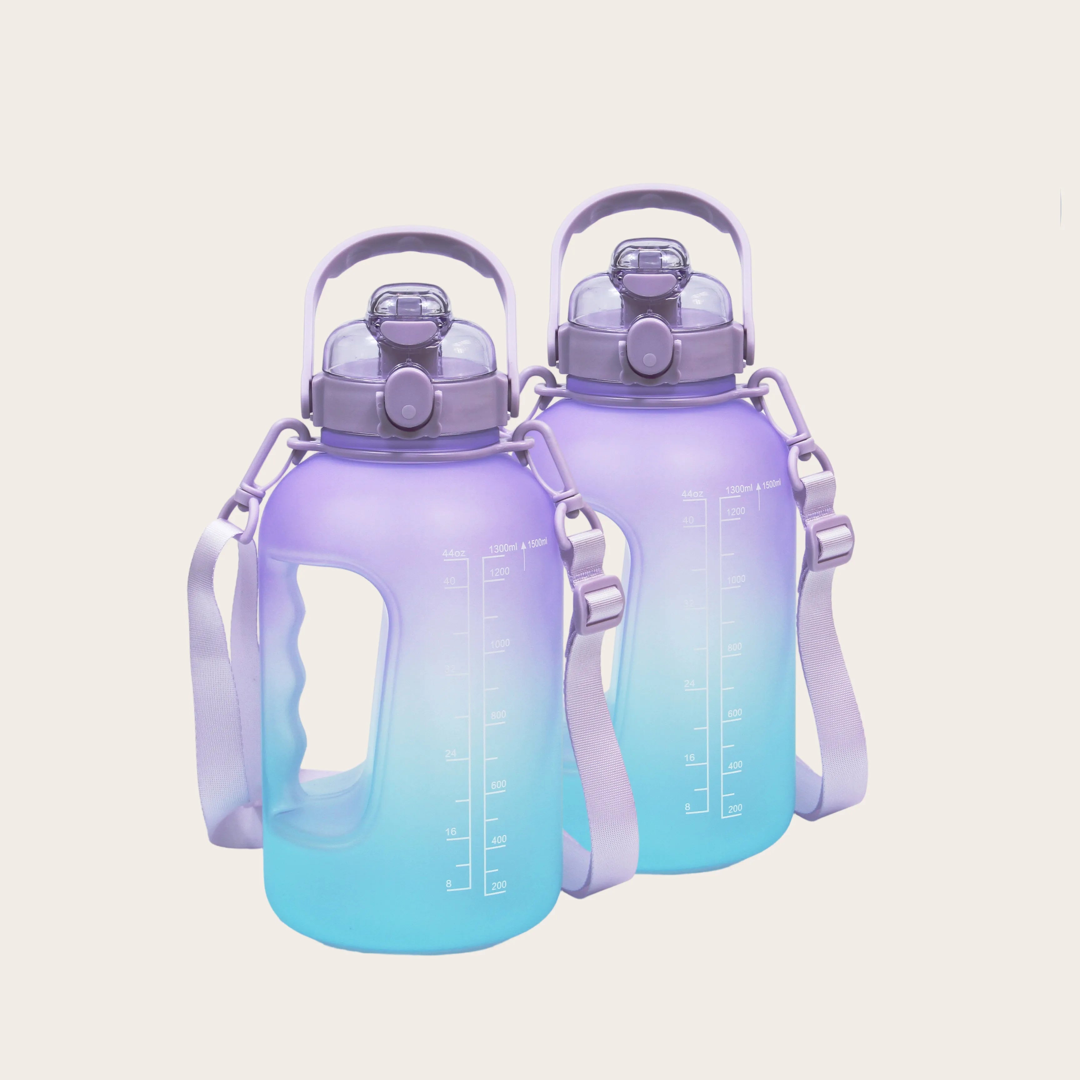 Pair of Sportive Lives GYM Bottles in purple and cyan gradient with 1.5L capacity, straw lid and carry strap, Canada-ready hydration set