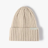 Sand beige high rib-knit cuffed beanie by Sportive Lives, soft warm winter hat, unisex one size 56–58 cm with fold-over cuff, Canada.