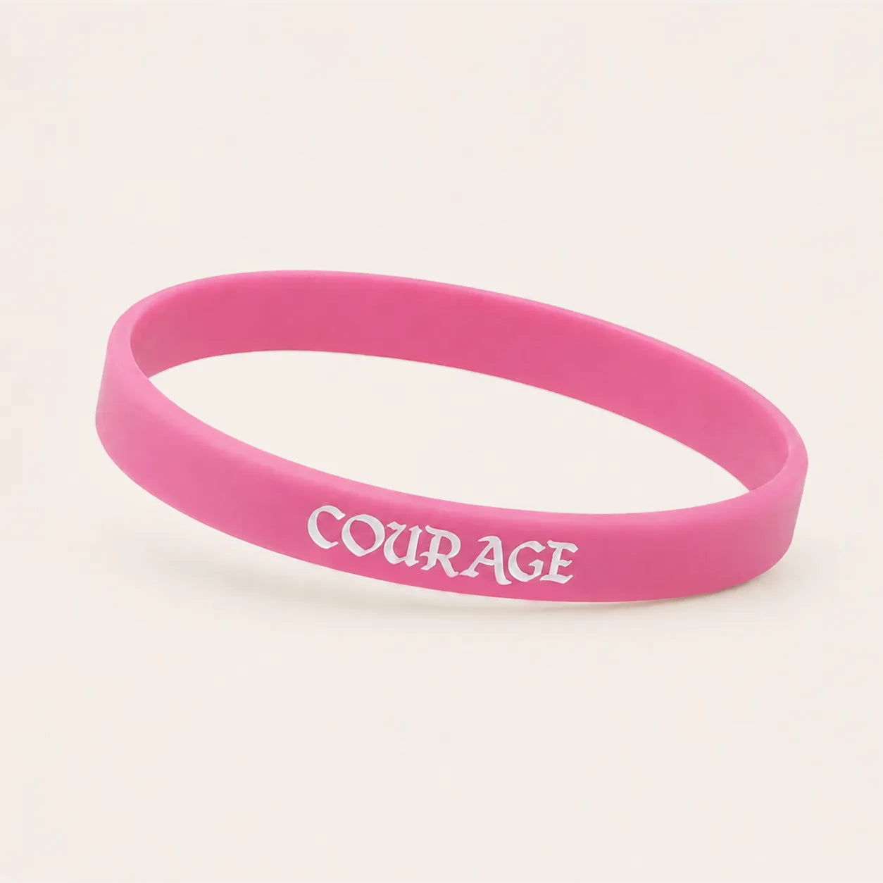 Hot pink motivational silicone wristband with white COURAGE lettering