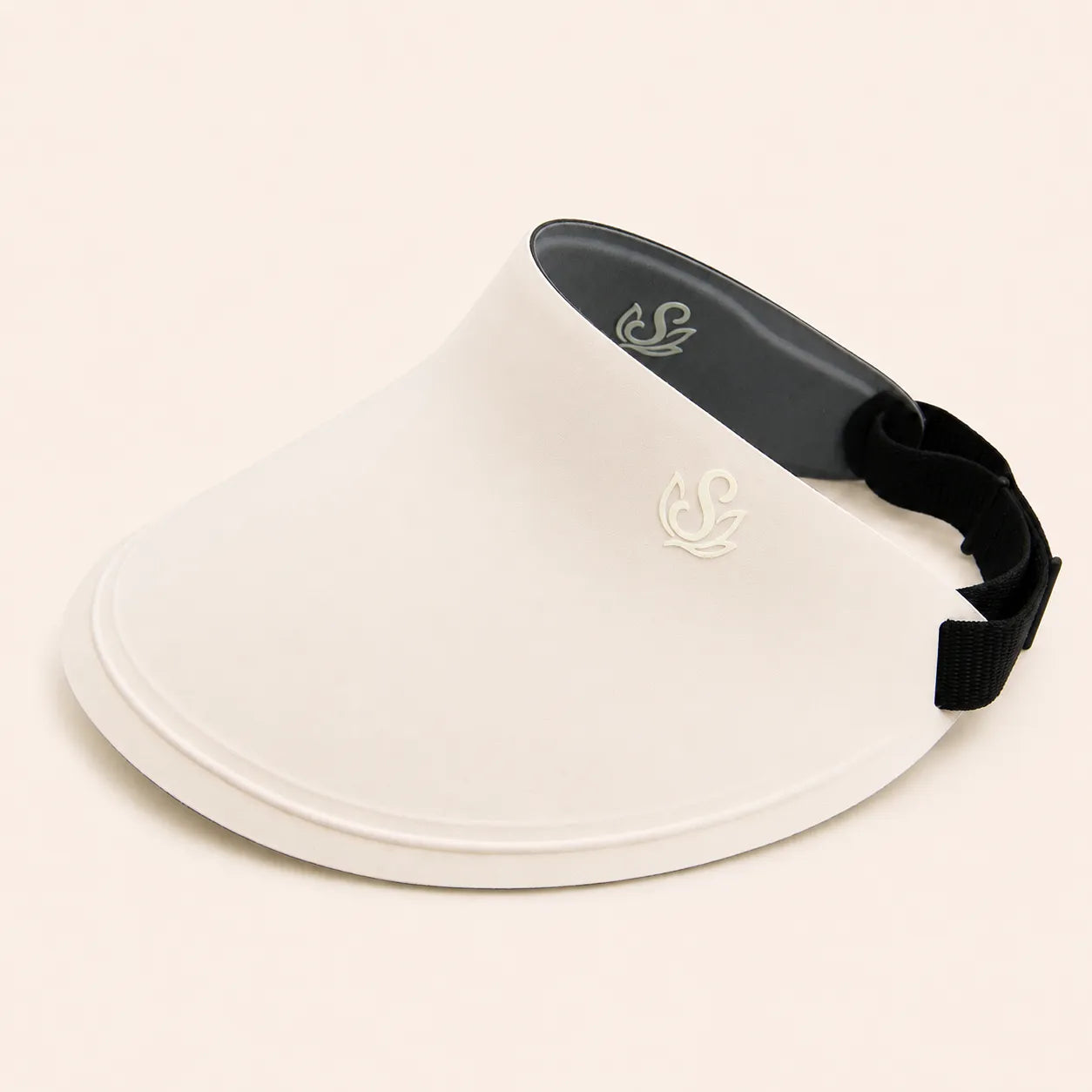 Ivory Sportive Lives reversible sun visor with black inner side, curved brim, and adjustable strap