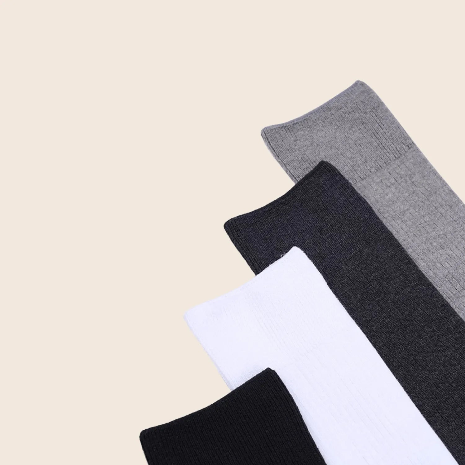 Close-up of Sportive Lives minimalist knee-high socks showcasing soft, breathable fabric in black, white, and gray colors.