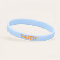 Charcoal grey silicone wristband with navy COURAGE lettering