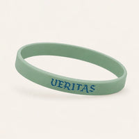 Mint green silicone wristband with blue VERITAS lettering