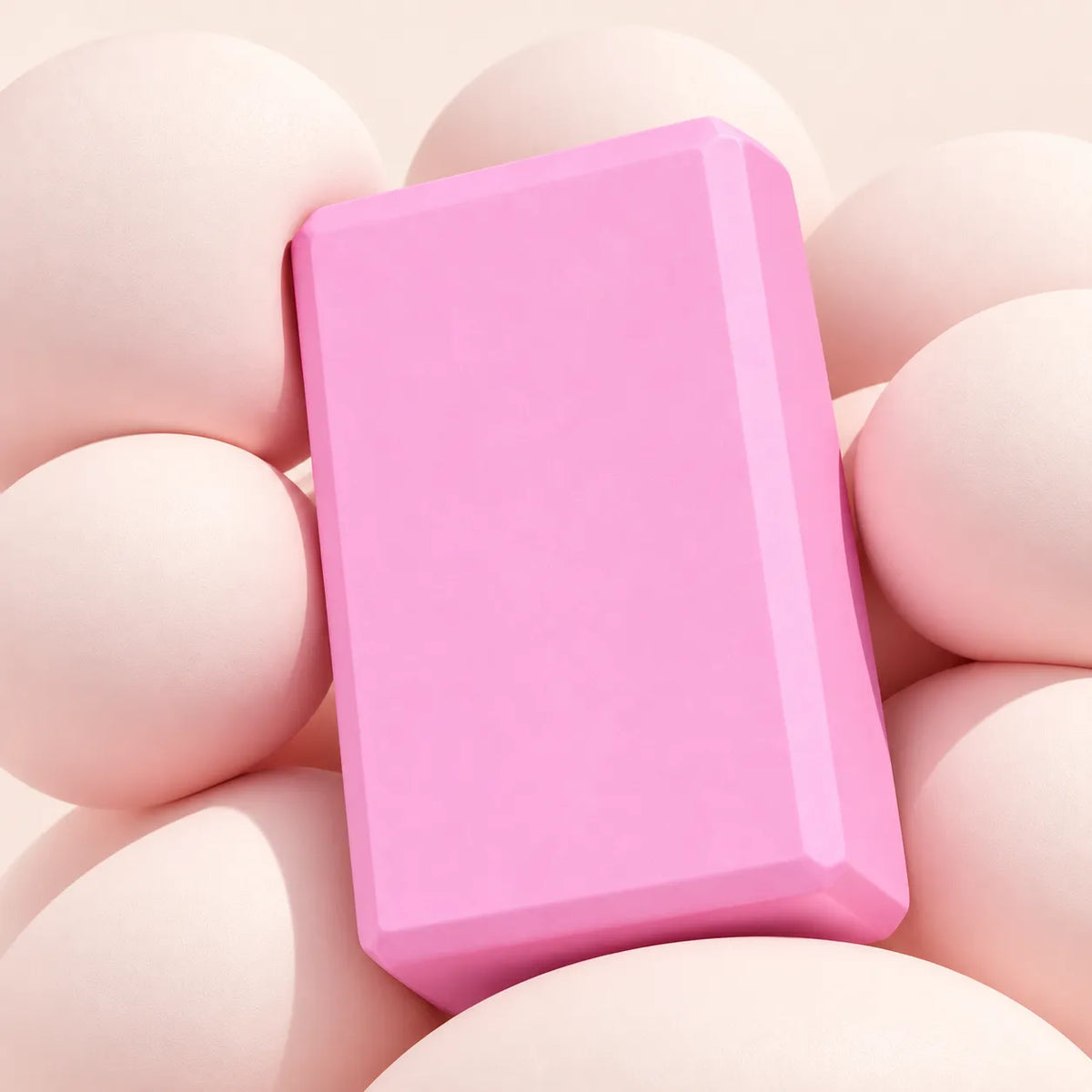 Pink high-density EVA yoga block on a neutral background