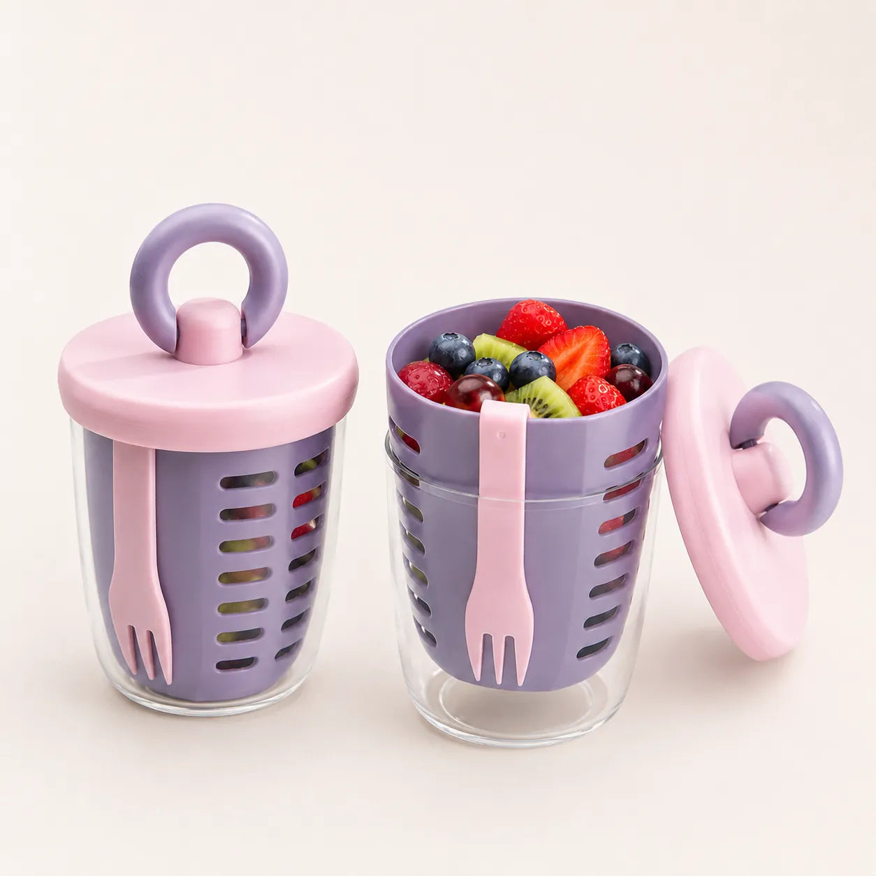 Lavender and baby pink Sportive Lives Portable Salad Cup with fresh fruit, clear outer cup, draining basket, and built-in fork