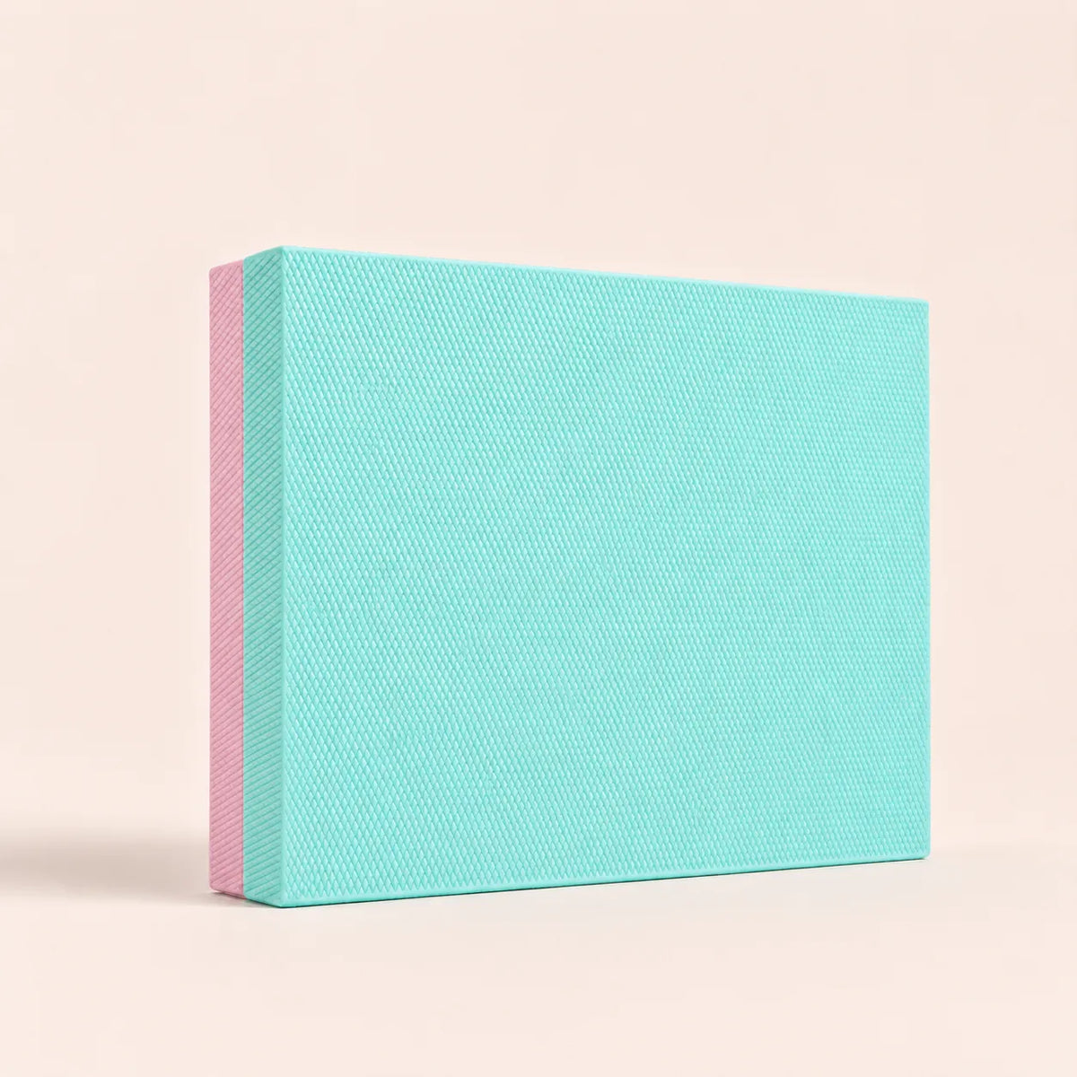 Mint green and pink TPE Yoga Balance Cushion Pad with textured non-slip surface by Sportive Lives