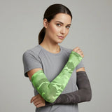 Model wearing green camo and charcoal camo UV arm sleeves — cooling, moisture-wicking sun sleeves with secure fit — Sportive Lives Canada