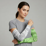 Model wearing mixed camo UV arm sleeves—grey camo and green camo—cooling, moisture-wicking sun sleeves with secure fit — Sportive Lives Canada