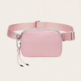 Pink waterproof nylon fanny pack / belt bag, organized interior — Sportive Lives Canada.
