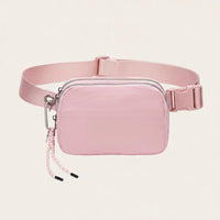 Pink waterproof nylon fanny pack / belt bag, organized interior — Sportive Lives Canada.
