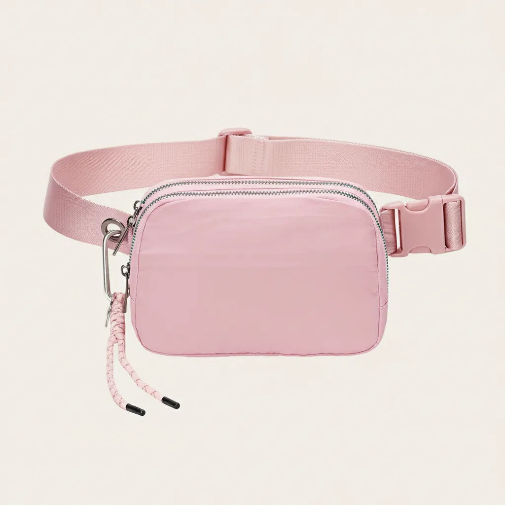 Pink waterproof nylon fanny pack / belt bag, organized interior — Sportive Lives Canada.