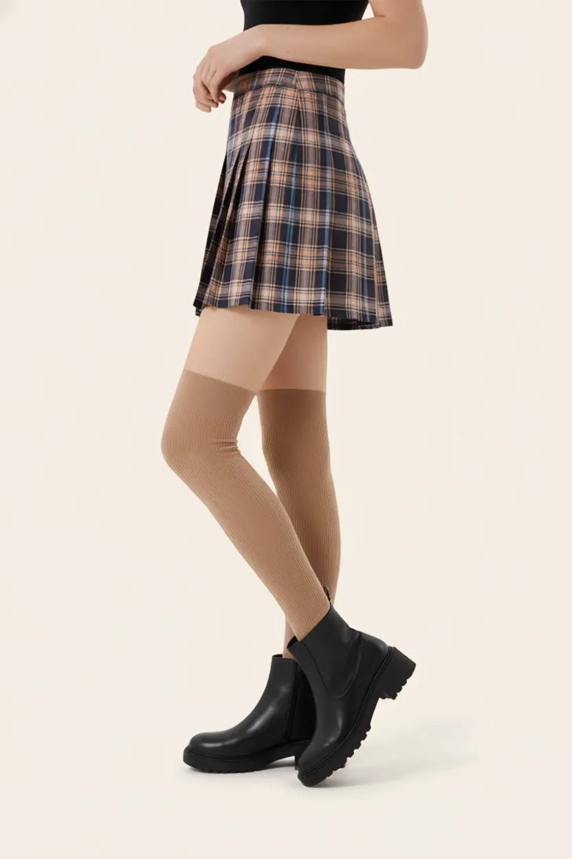 Sand beige ribbed thigh-high socks for women, neutral warm tone with ankle boots.