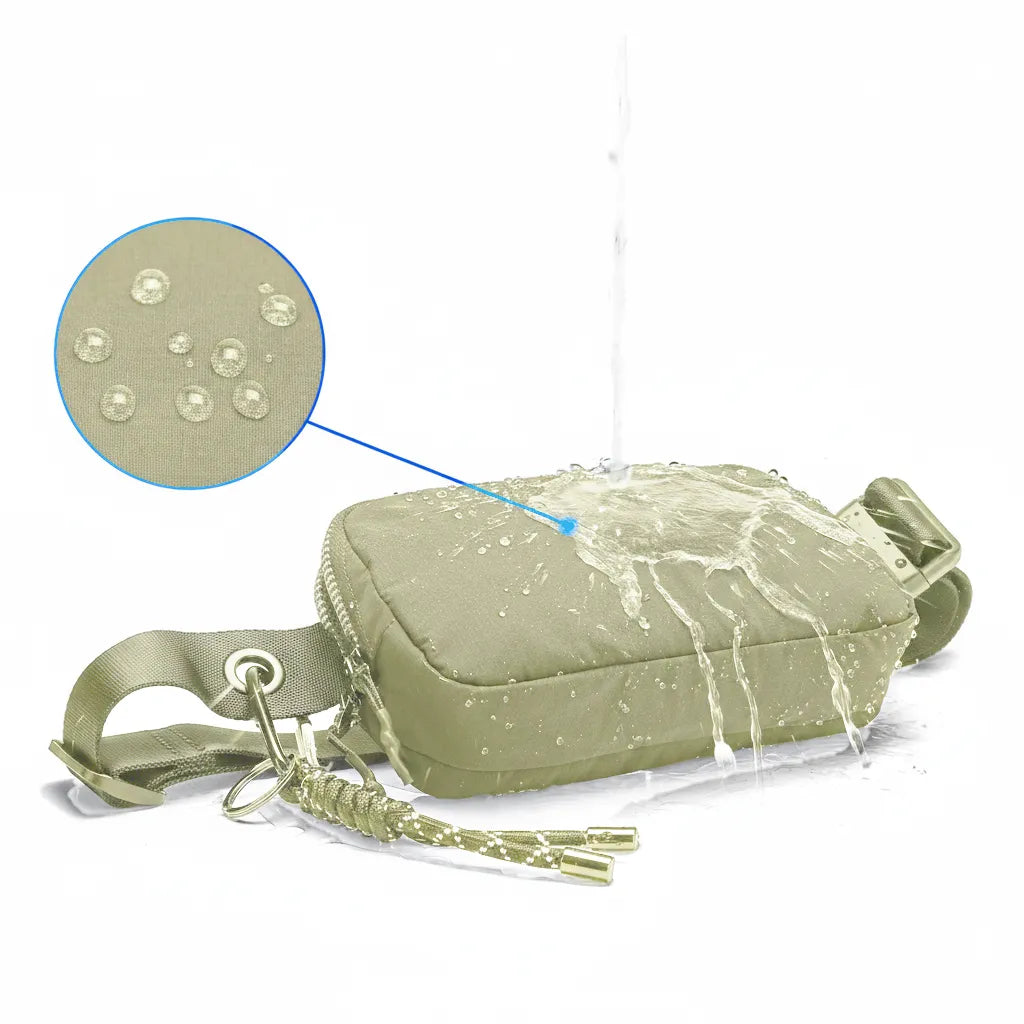 Olive waterproof nylon belt bag with water pouring on the surface; droplets beading to show hydrophobic IPX4 coating.