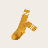 Stylish socks low in bright yellow cotton featuring white retro stripes, ideal for trendy spring and summer outfits from Sportive Lives.