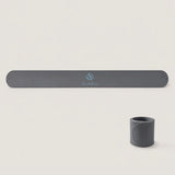Charcoal gray Yoga Mat Slap Band displayed flat and wrapped into a compact coil