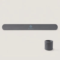 Charcoal gray Yoga Mat Slap Band displayed flat and wrapped into a compact coil