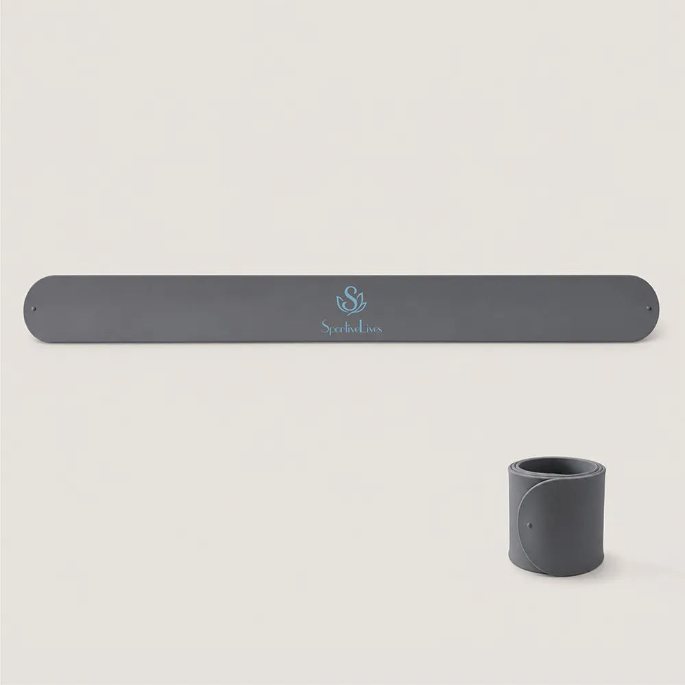 Charcoal gray Yoga Mat Slap Band displayed flat and wrapped into a compact coil
